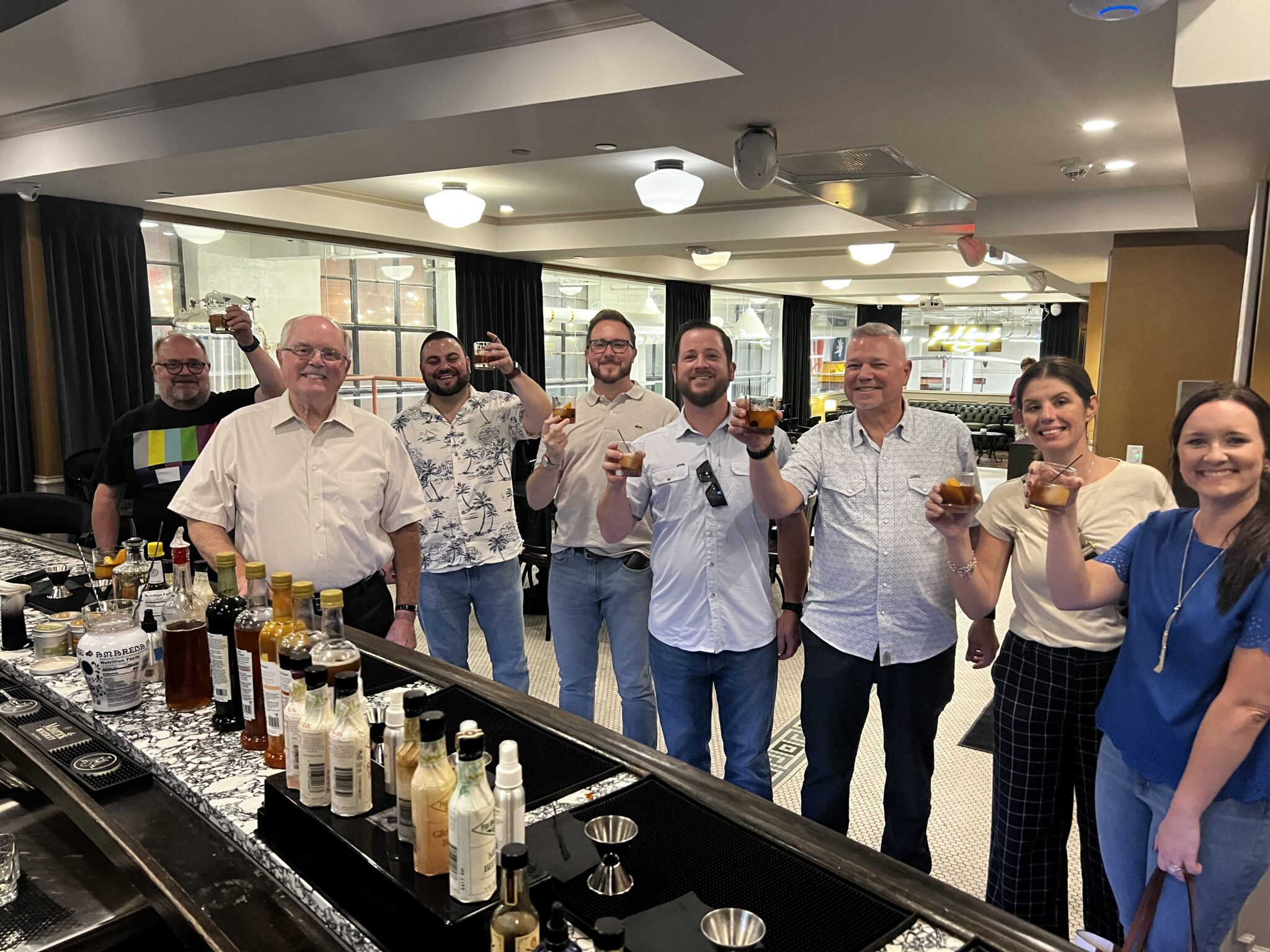 A group raising a toast at a private tasting