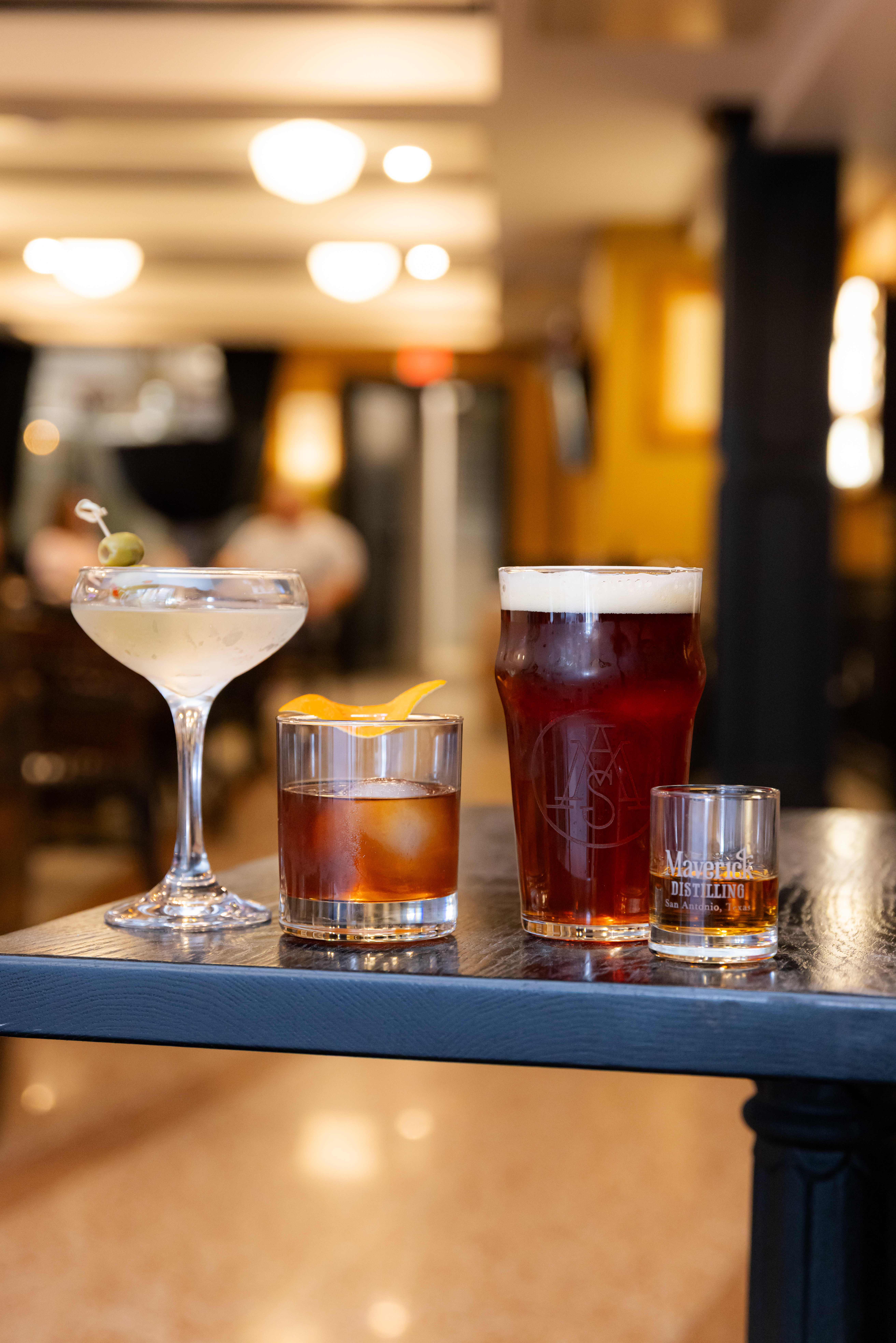 A happy hour spread of cocktails and beer