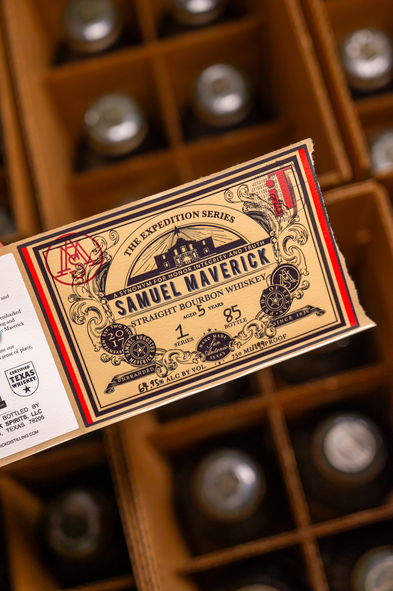 Labelling bottles at the distillery